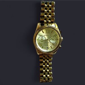 Michael Kors gold toned watch needs battery Roman numerals